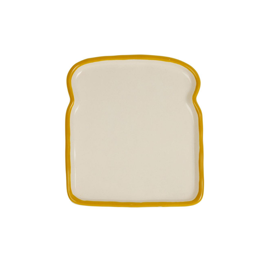 Assiette en grès écru en forme de tranche de pain de mie avec liseré jaune, collection Réveil Gourmand SEMA Design.