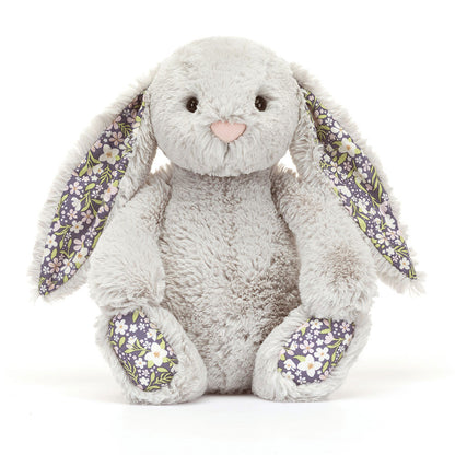 Peluche lapin gris argenté Jellycat Blossom Silver Bunny Bloom avec imprimé floral dans les oreilles.
