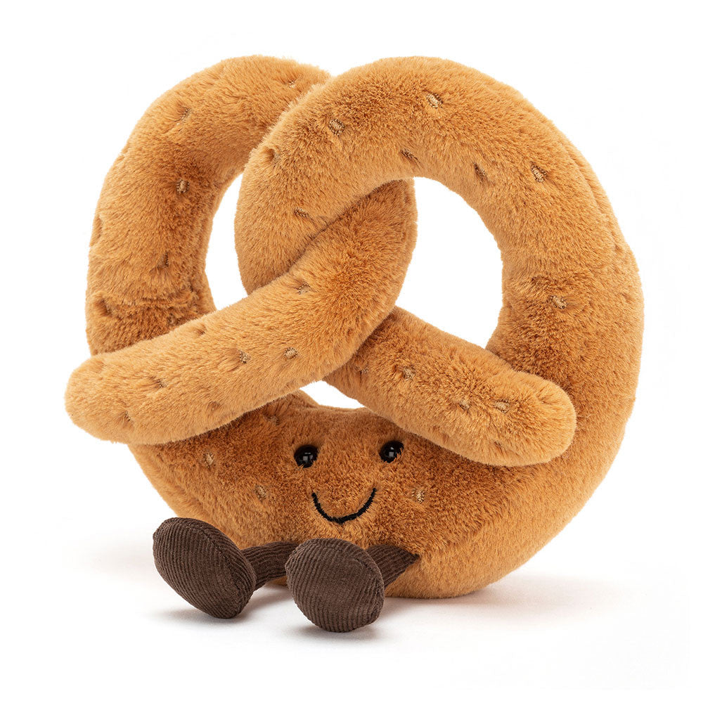 Peluche Amuseable Bretzel Jellycat marron doré avec sourire et pieds en velours côtelé.