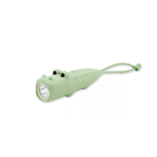 Lampe de poche en silicone vert pâle en forme de crocodile Kroko avec sangle de transport.