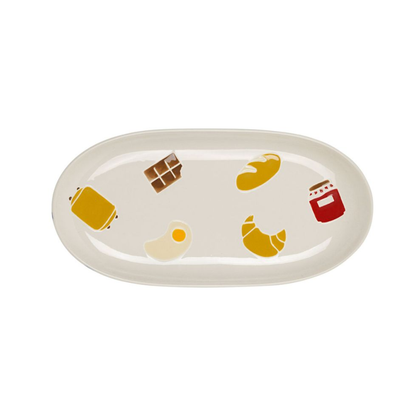 Plat ovale en grès crème SEMA Design avec illustrations de croissant, œuf, confiture et chocolat.