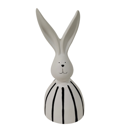 Statuette de lapin stylisée blanche avec rayures noires verticales sur le corps et longues oreilles, hauteur 26cm.